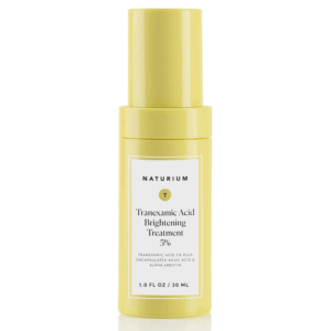 Naturium Tranexamic Acid 5% Brightening Treatment serum in a yellow bottle, designed to target dark spots and uneven skin tone.