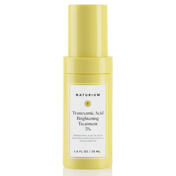Naturium Tranexamic Acid 5% Brightening Treatment serum in a yellow bottle, designed to target dark spots and uneven skin tone.