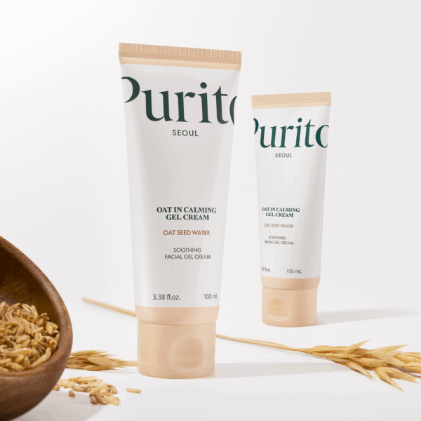 Two Purito Oat-In Calming Gel Cream tubes placed with oat grains on a white background, emphasizing the product’s natural soothing and hydrating benefits.