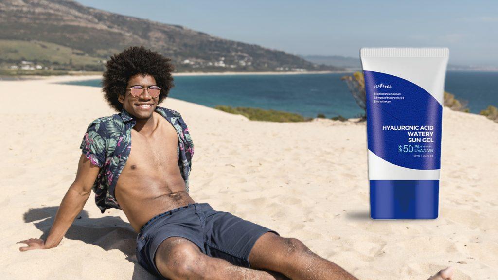 Comparing Mineral and Synthetic Sunscreens Man sitting uin sub with isntree sunscreen Dreamskinhaven