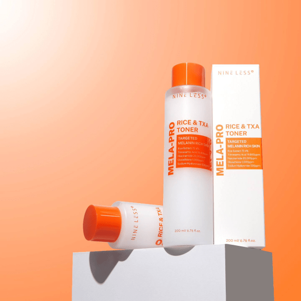 A sleek, minimalist bottle of Nineless Melapro TXA & Rice Toner placed on a softly blurred background, highlighting its brightening, hydrating, and skin-soothing formula designed to target hyperpigmentation and enhance radiance.