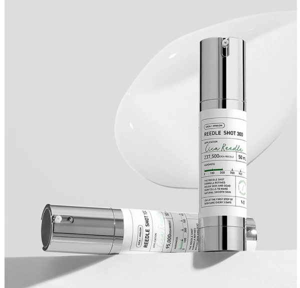 A sleek, science-driven bottle of VT Cosmetics Reedle Shot placed on a softly blurred background, emphasizing its innovative micro-spicule technology for collagen boosting, skin renewal, and enhanced absorption.