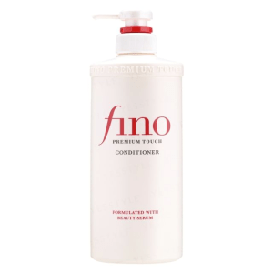 A sleek red tub of Fino Premium Touch Conditioner placed on a neutral background, highlighting its luxurious formula for deep hydration, shine, and frizz control.