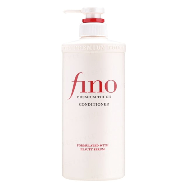 A sleek red tub of Fino Premium Touch Conditioner placed on a neutral background, highlighting its luxurious formula for deep hydration, shine, and frizz control.