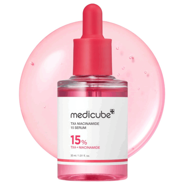 Close-up of Medicube TXA Niacinamide 15 Serum with pink background and dropper cap, showing its brightening formula