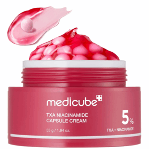 Open jar of Medicube TXA + Niacinamide Capsule Cream showing pink capsules and smooth texture