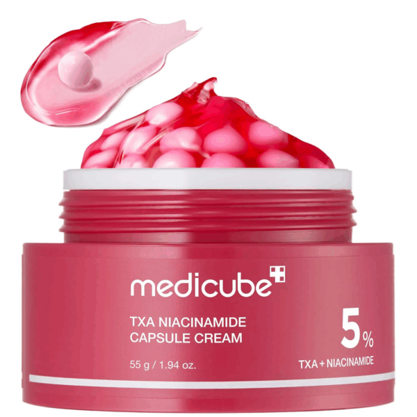 Open jar of Medicube TXA + Niacinamide Capsule Cream showing pink capsules and smooth texture