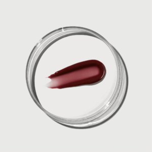 Swatch of deep berry shade from Naturium Phyto-Glow Lip Balm SPF 45
