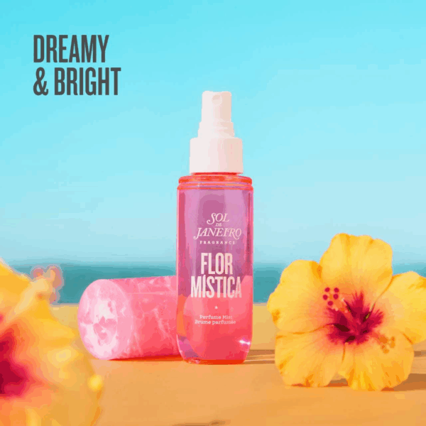 Flor Mistica perfume mist standing on a beach scene with bright flowers and blue sky.