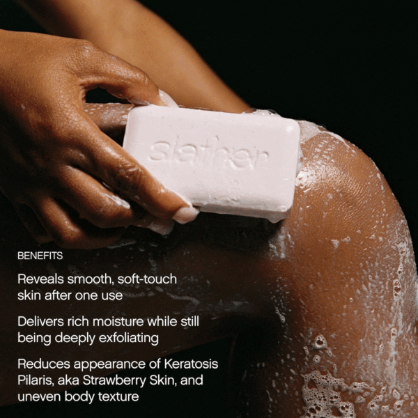 Leg being cleansed with the Slather body bar while benefits text overlays.
