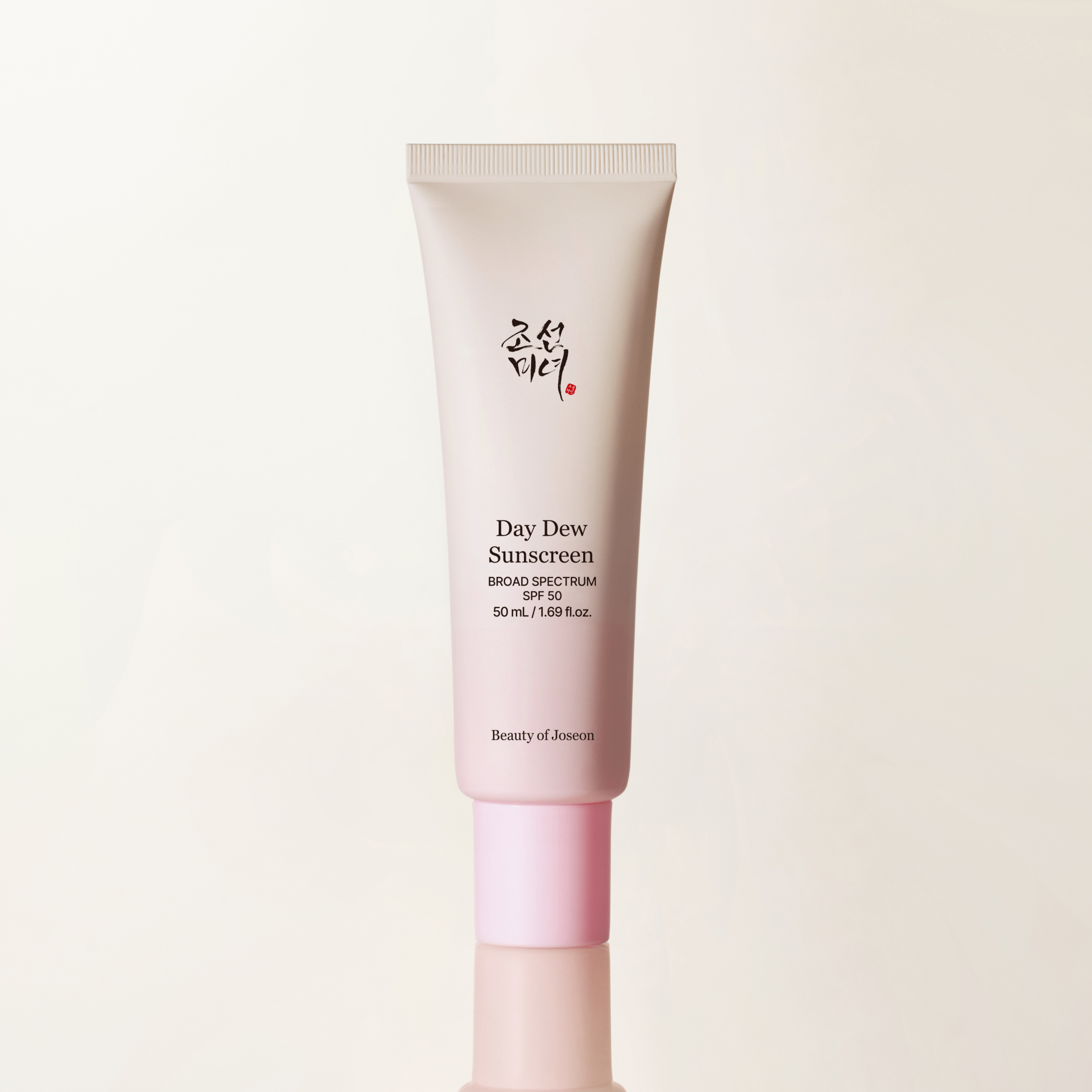 Beauty of Joseon Day Dew Sunscreen SPF 50+ tube product shot on a soft neutral background