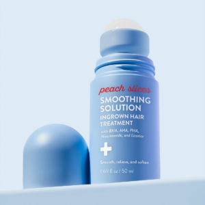 Close up of Peach Slices Smoothing Solution Ingrown Hair Treatment on blue background